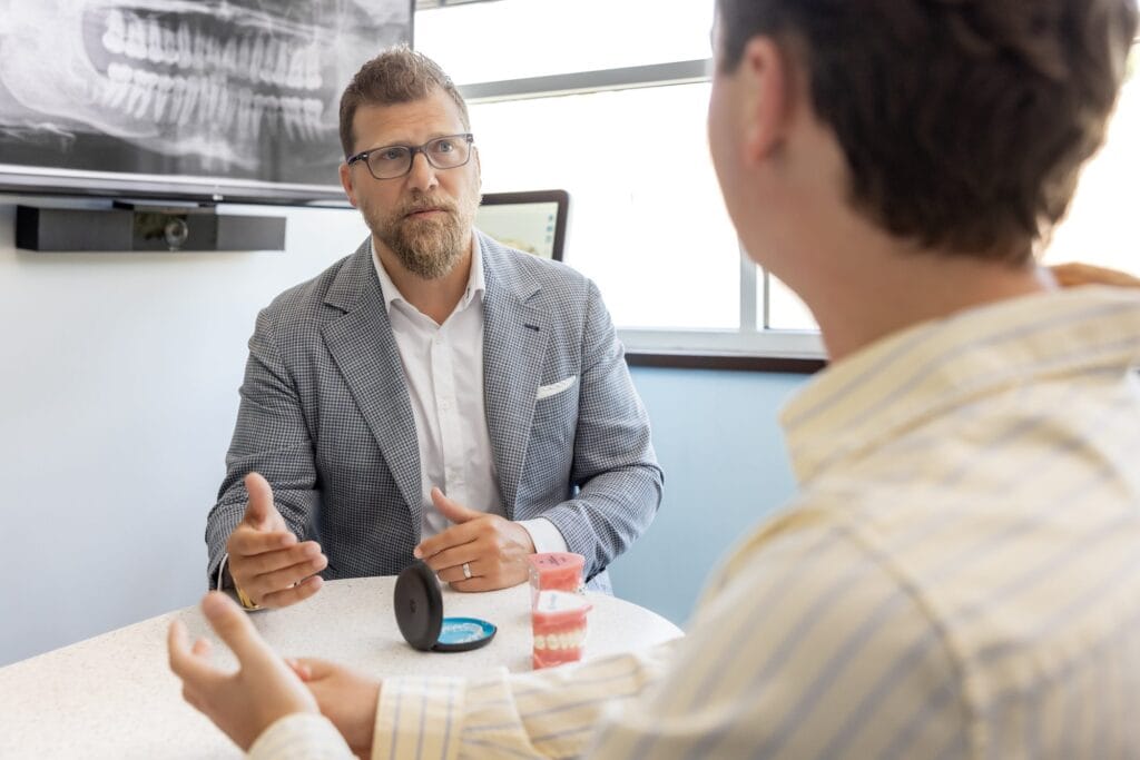 Retainer Subscription 6 Orthodontist discussing retainers with a patient