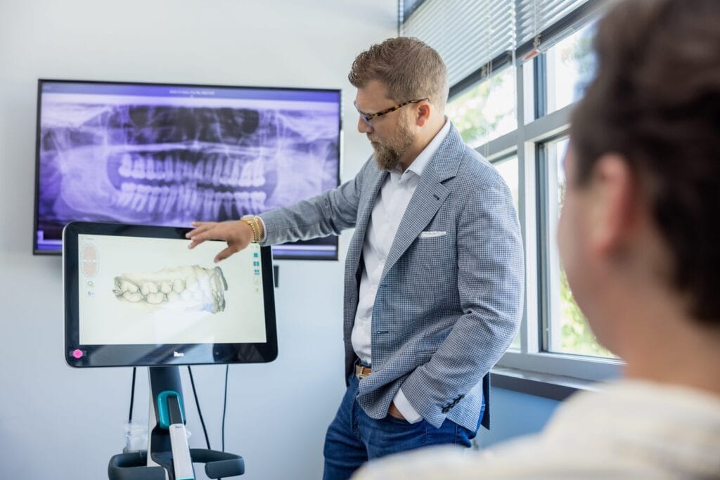 Orthodontist reviewing a digital scan with a patient